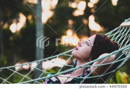 woman relaxing in a hammock 44970384