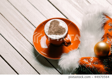 cup of coffee and christmas decorations cup of coffee and christmas decorations 44970564