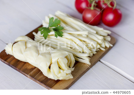 Homemade chechil cheese with fresh tomatoes Homemade chechil cheese with fresh tomatoes 44970605