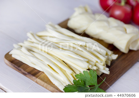 Homemade chechil cheese with fresh tomatoes Homemade chechil cheese with fresh tomatoes 44970606