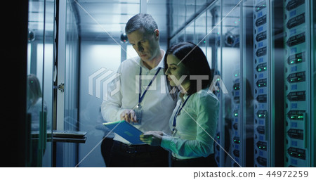 Data center colleagues with tablets Data center colleagues with tablets 44972259
