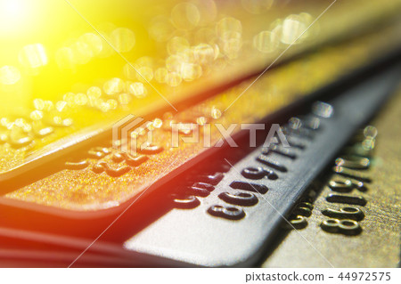 Gold and platinum credit cards close up Gold and platinum credit cards close up 44972575