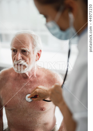 Listening to adult female heart beat with stethoscope were not Listening to adult female heart beat with stethoscope share
