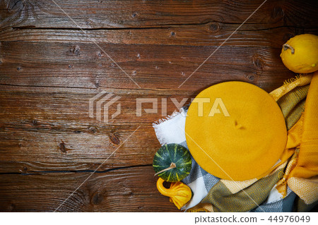 Autumn clothes top down view on wooden table Autumn clothes top down view on wooden table 44976049