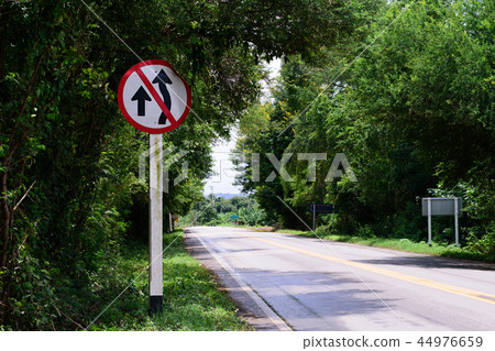 Traffic sign no over taking in the countryside 44976659