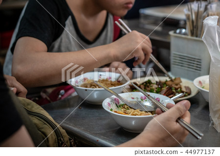 Noodles filled with chopsticks 44977137