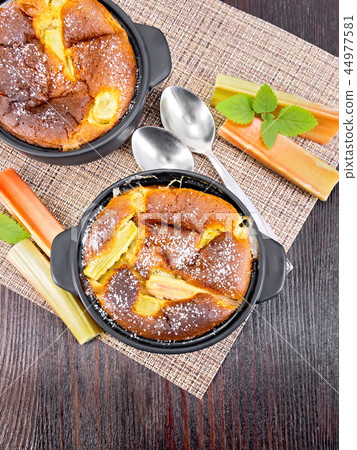 Klafuti with rhubarb in brazier on board top 44977581