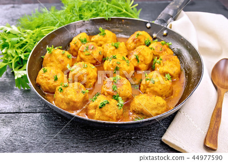 Meatballs in pan with sauce on board 44977590