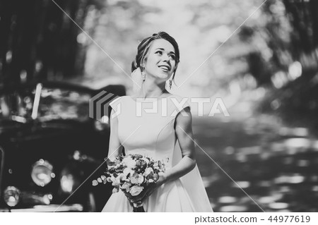 Beautiful fashion bride in wedding dress posing Beautiful fashion bride in wedding dress posing 44977619