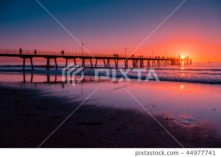 People on pier at sunset People on pier at sunset 44977741