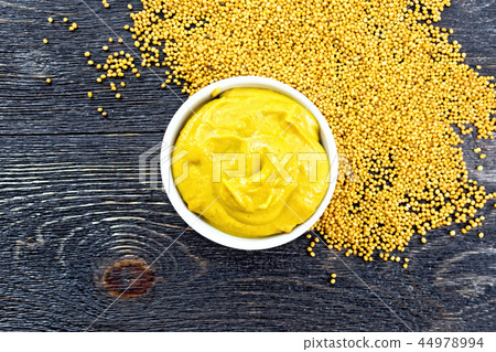 Sauce mustard in bowl on board top 44978994