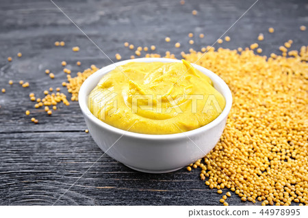 Sauce mustard in bowl on board 44978995