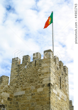 Portuguese flag on tower of Sao Jorge Castle.  44981743