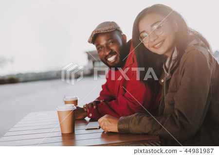 Cute young people smiling while looking at you Cute young people smiling while looking at you 44981987