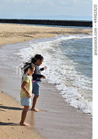 Play on the sandy beach 44982820