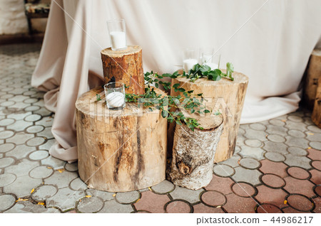Rustic wedding decor on a timber background. Main table setting for bride and groom newlyweds 44986217