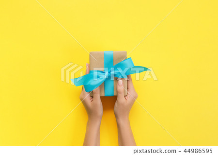 Woman hands give holiday handmade present 44986595