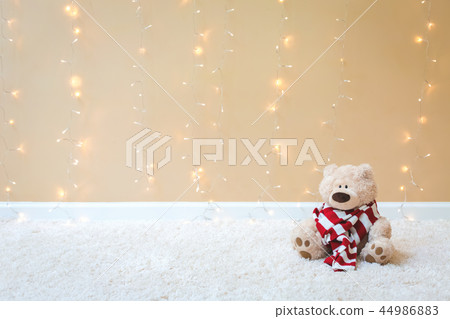 Teddy bear with red striped scarf 44986883