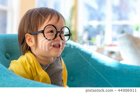 Toddler boy playing in his house Toddler boy playing in his house 44986911