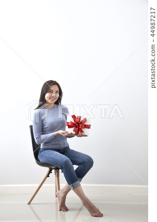 young girl with christmas gift young girl with christmas gift 44987217