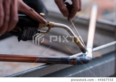 Welding of copper pipe. 44987558