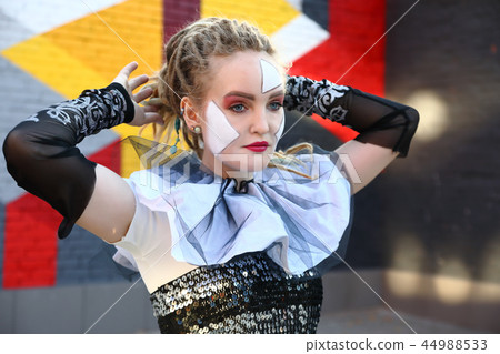 Young woman clown outdoors 44988533