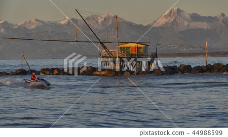 View of a modern Santa Claus driving a jet ski 44988599