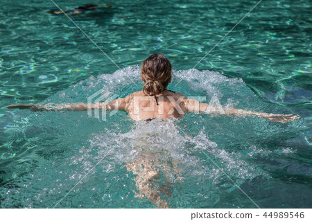 Young woman swimming 44989546