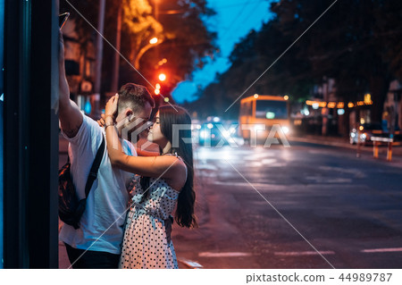 Young couple in the streets of the evening city 44989787