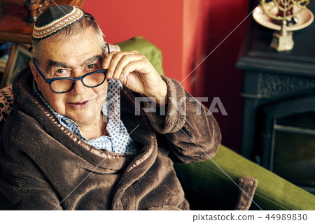 Jewish senior with glasses in the armchair Jewish senior with glasses in the armchair 44989830