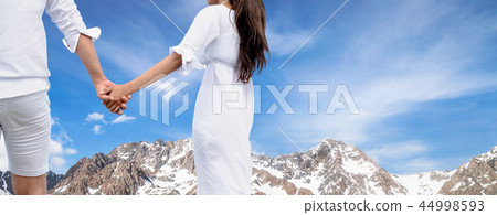 Man and woman couple hold hands together. Man and woman couple hold hands together. 44998593