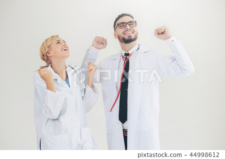 Happy doctor celebrates success with partner. Happy doctor celebrates success with partner. 44998612