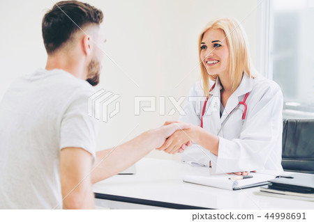 Doctor shake hand with patient in the hospital. 44998691