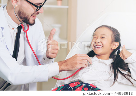 Doctor examining little happy kid in hospital. 44998918