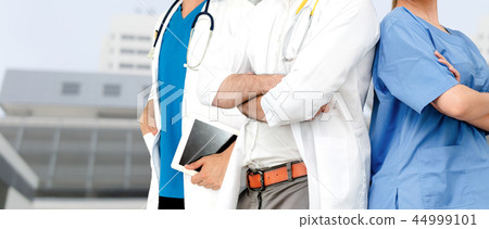 Doctor working in hospital with other doctors. Doctor working in hospital with other doctors. 44999101