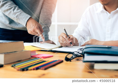 Group of students are writing a university test. Group of students are writing a university test. 45000518