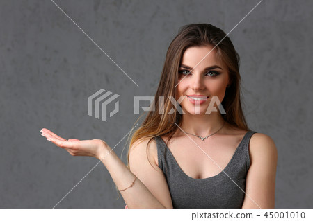 A caucasian woman on a gray background 45001010