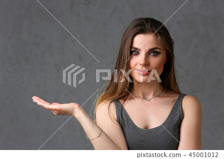 A caucasian woman on a gray background 45001012