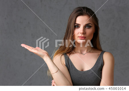 A caucasian woman on a gray background A caucasian woman on a gray background 45001014