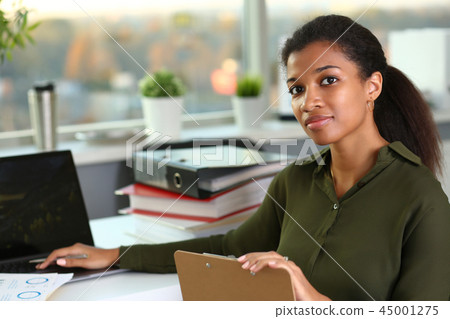 Beautiful smiling businesswoman portrait workplace Beautiful smiling businesswoman portrait workplace 45001275
