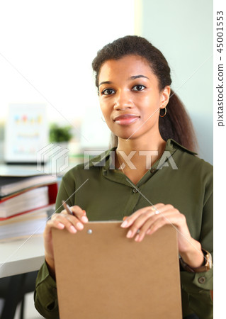 Beautiful smiling businesswoman portrait workplace 45001553
