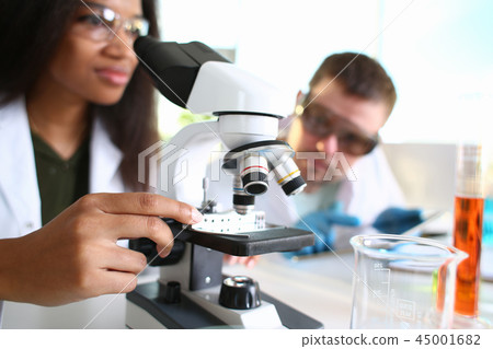 Two scientists of a student chemist are conducting Two scientists of a student chemist are conducting 45001682