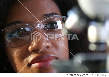 Black female chemist student conducting research Black female chemist student conducting research 45001817