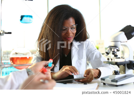A female doctor in a chemical laboratory holds A female doctor in a chemical laboratory holds 45001824