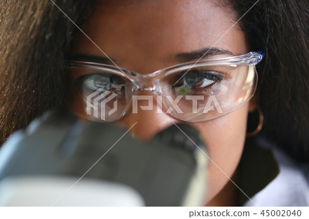 Black woman scientist student chemist in protective 45002040