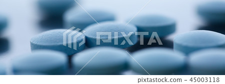 Tablets scattered on the table of the 45003118