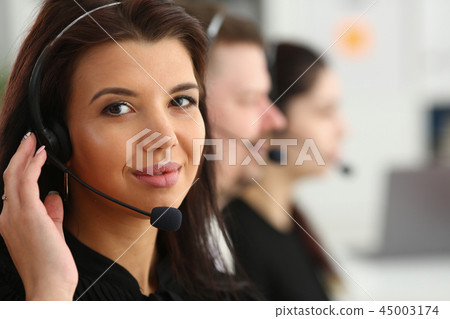 Three call centre service operators at work 45003174