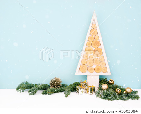 Christmas wooden tree over dark light blue background. Christmas wooden tree over dark light blue background. 45003384