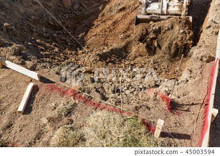 Small Bulldozer Digs In Yard For Pool Installation Small Bulldozer Digs In Yard For Pool Installation 45003594
