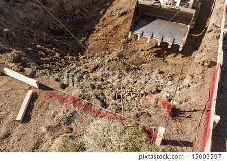 Small Bulldozer Digs In Yard For Pool Installation Small Bulldozer Digs In Yard For Pool Installation 45003597